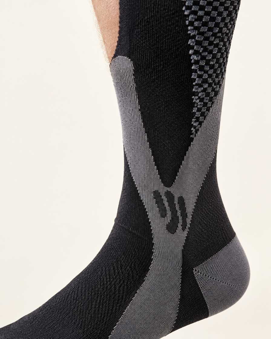 Close-up of the X-shaped support panel wrapping the ankle
