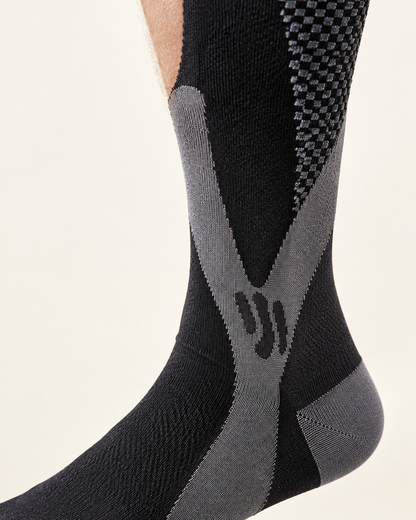Close-up of the X-shaped support panel wrapping the ankle